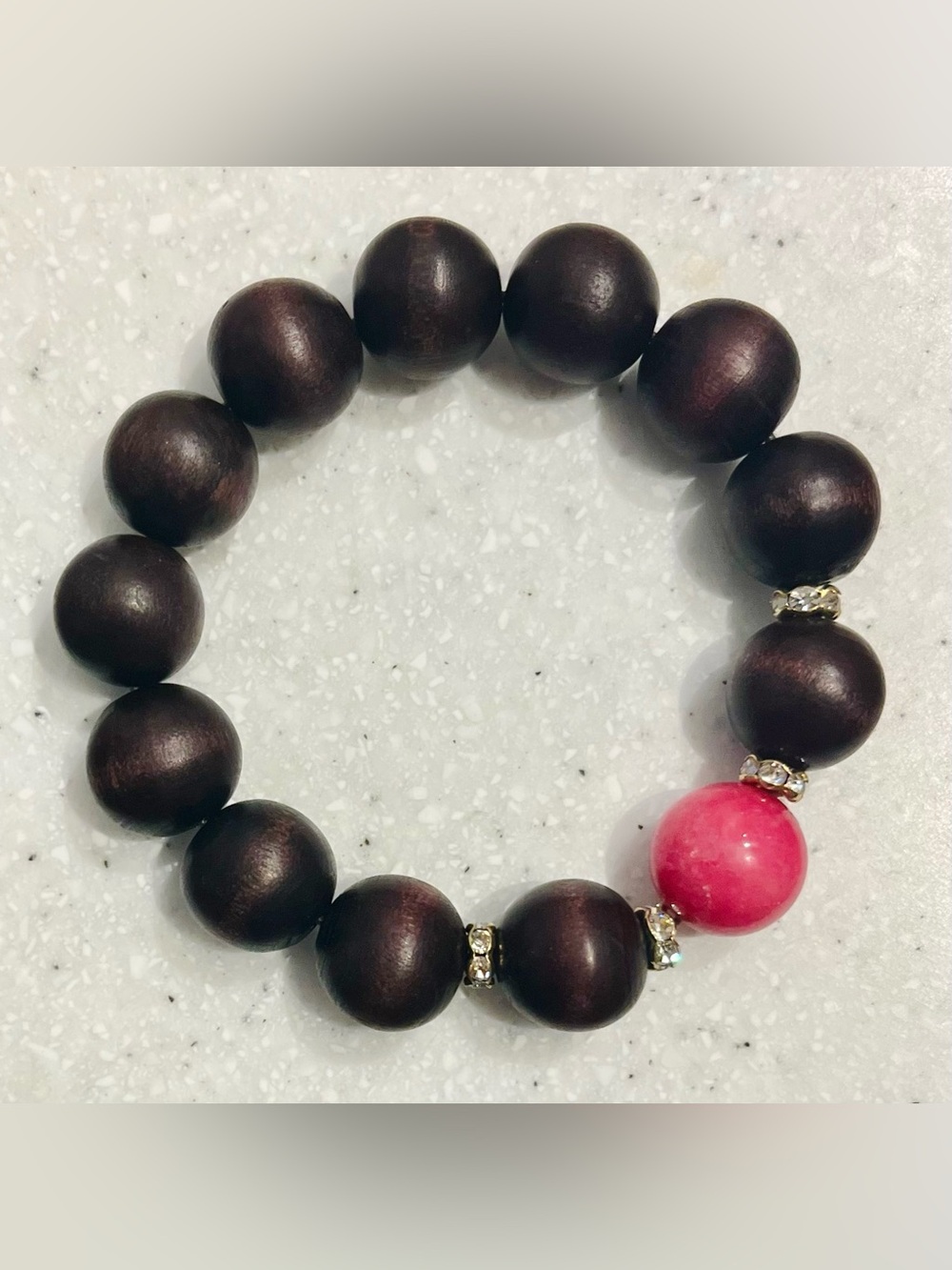 Handcrafted Dark Wood Beaded Stretch Bracelet with Pink Accent